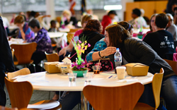 Women greet each other at the Breast Cancer Summit