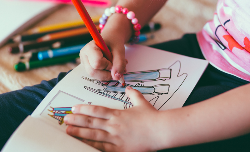 child using a coloring book