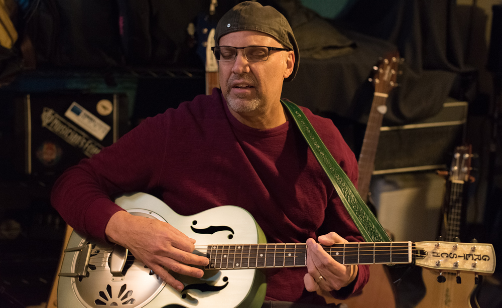 Clint Lavens playing guitar