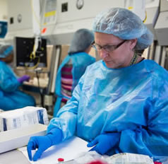 image of health care worker in front of a computer