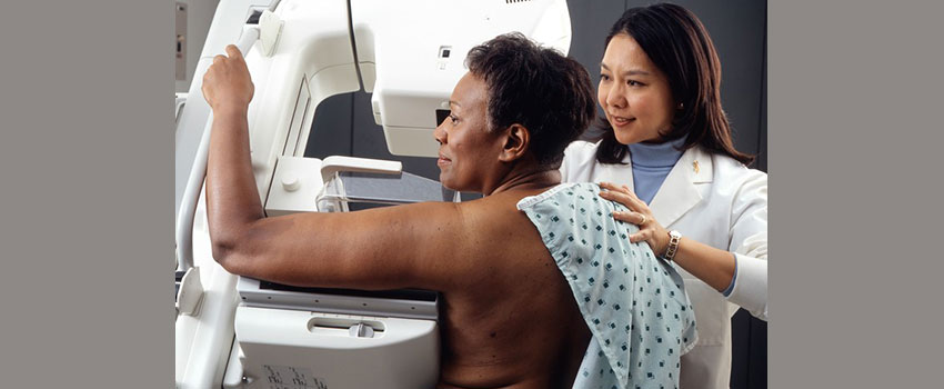 Black woman getting a mammogram