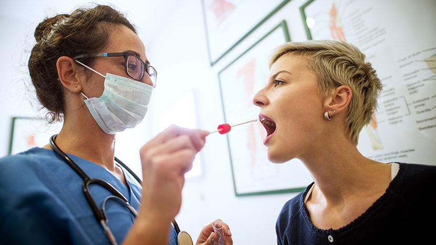 doctor taking a genetic sample from a patient