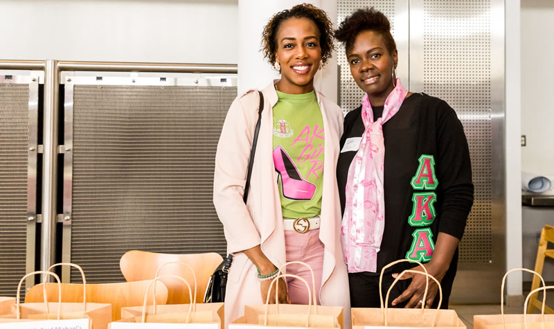 the two hosts of the raffle and door prize table