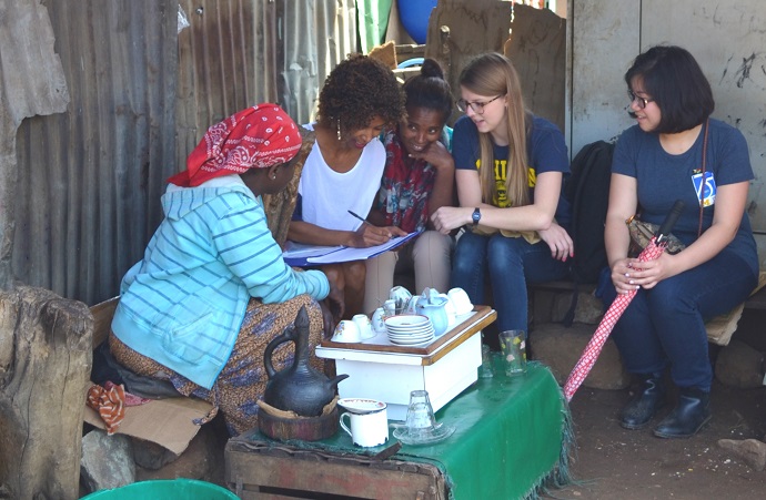 image of researchers with children