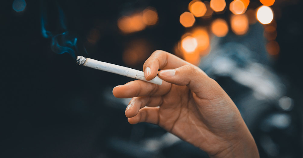 image of hand holding a cigarette