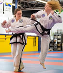 Barbara Hilija Spiessl practicing Taekwon-Do with her sister, Heidi