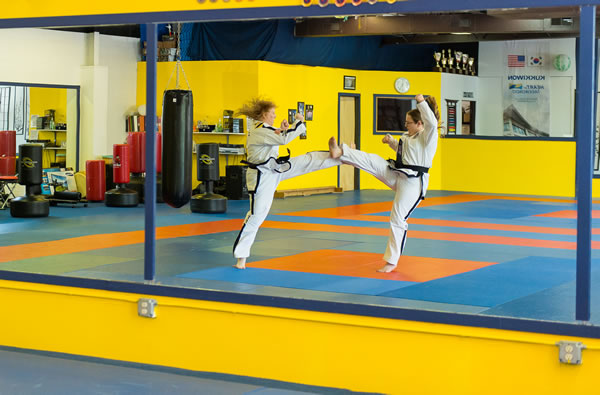 Barbara Hilija Spiessl and her sister, Heidi, practicing Taekwon-Do