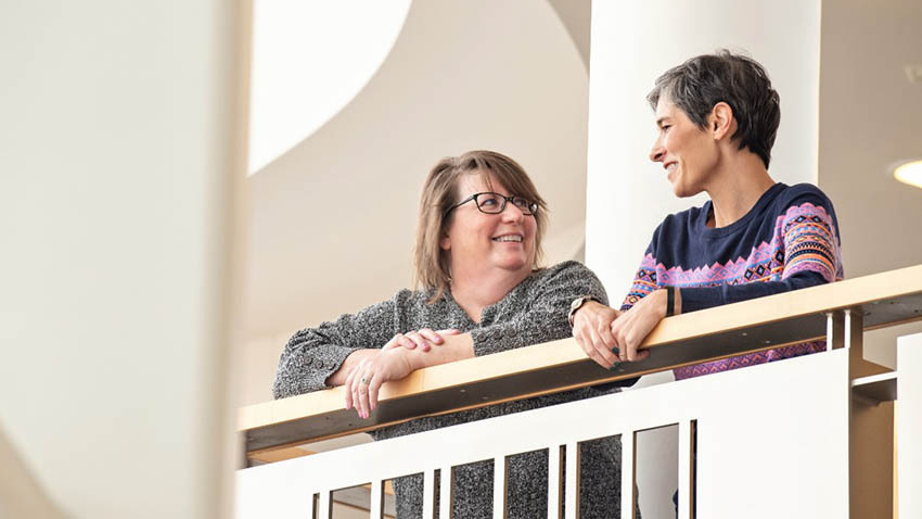 Patients Andrea Passmore and Katie Dorr chat at Michigan Medicine. Photo credit: Leisa Thompson