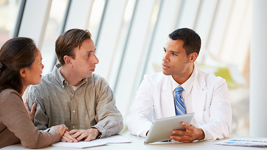 Doctor talking to a couple