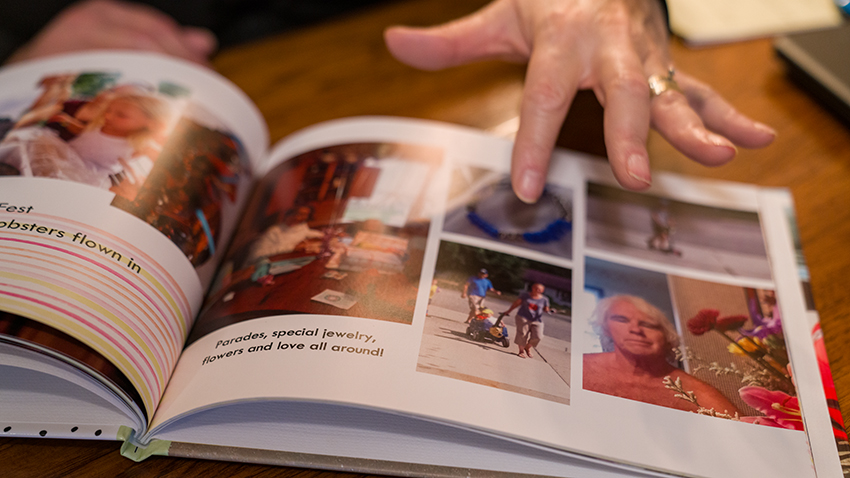 Kathy Bellmore looks through a photo album