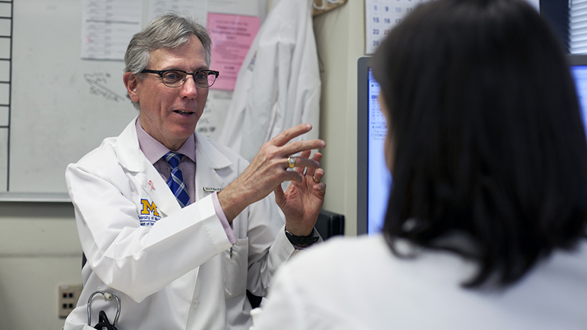 Dan Hayes, M.D. talking with a patient