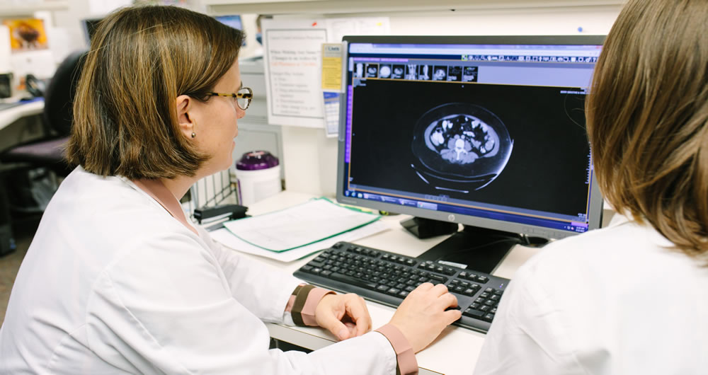 Karen McLean looking at mri