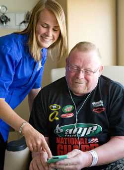 Jayne Knoff helps Michael Manning learn to use an ipod