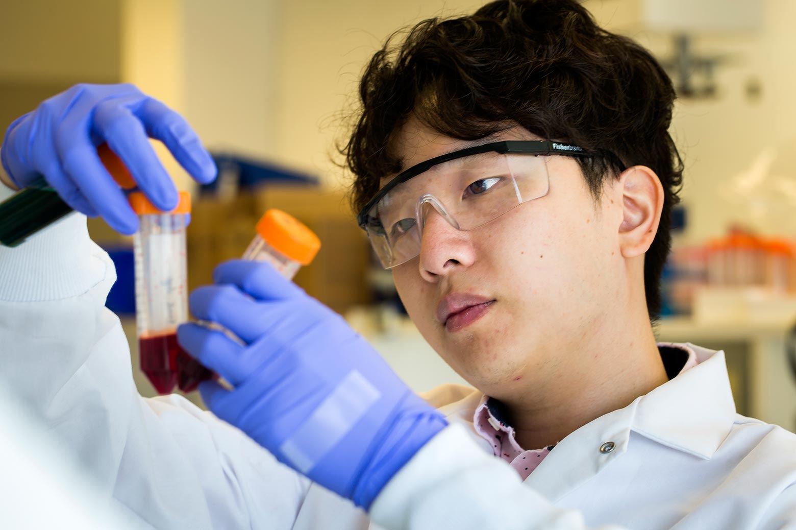 Eric Lin preparing to run blood samples through the labyrinth chip,