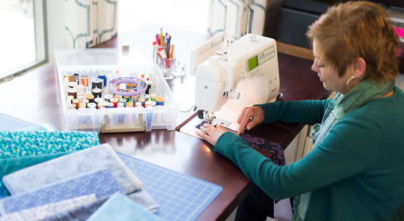 Janet Schuler at her sewing machine