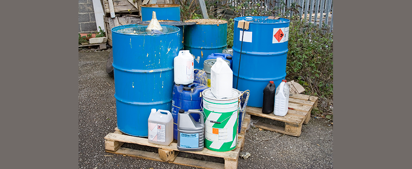 image of metal containers with symbols to show they contain medical waste
