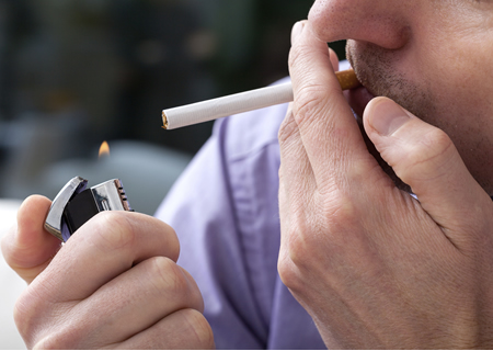 image of a man smoking a cigarette