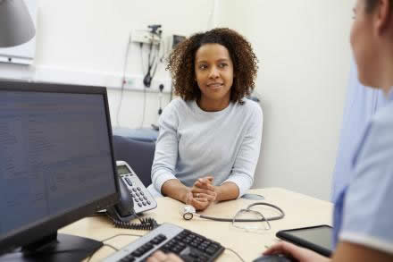 Female patient talking with a health care professional