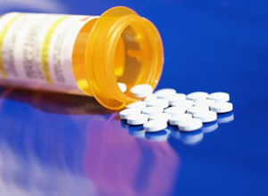 Image of prescription bottle and pills