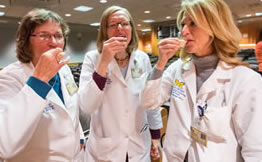 image of the three dieticians sampling liquid supplements