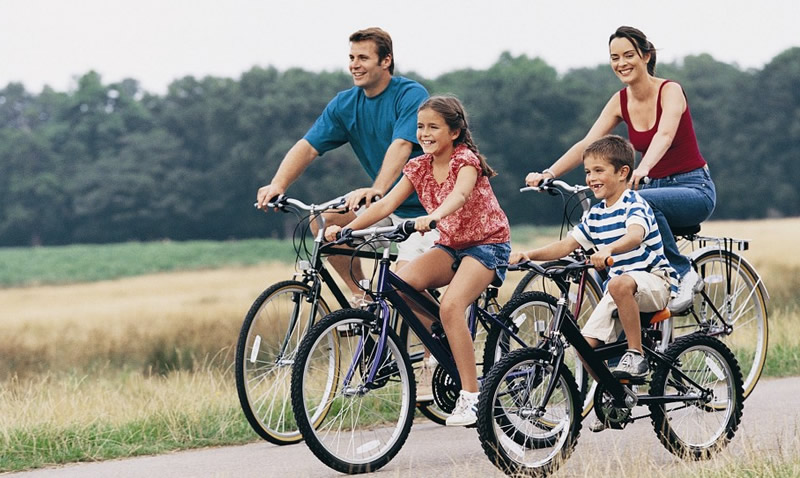 family riding bikes together