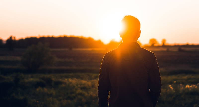 person standing in sunshine