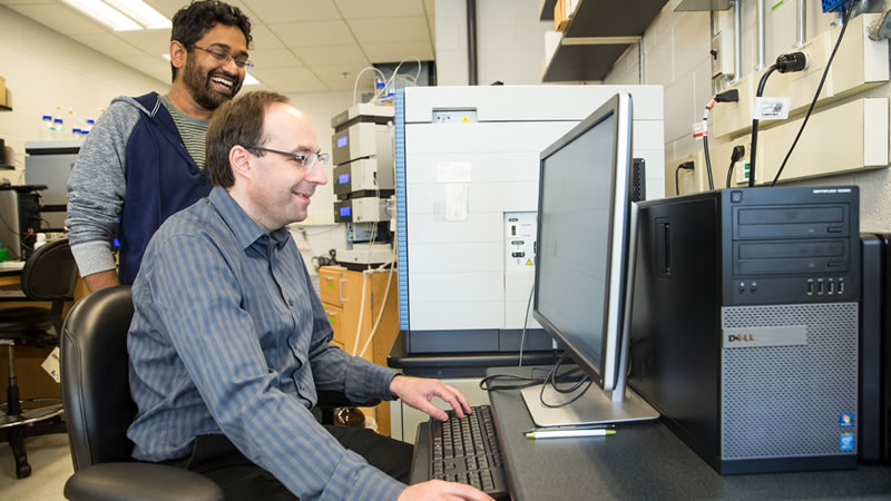 Alexey I. Nesvizhskii, Ph.D. and lab assistant