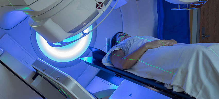Young woman with breast cancer getting radiation treatment