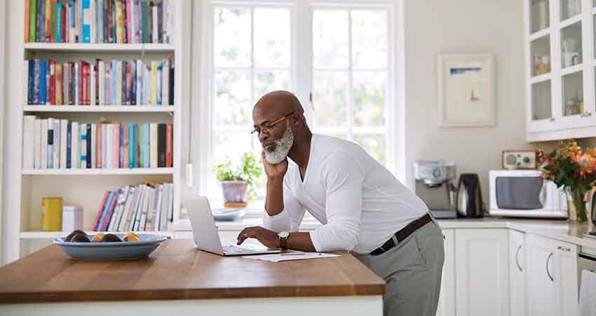 black man using his laptop