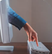 Image of finger on a computer keyboard