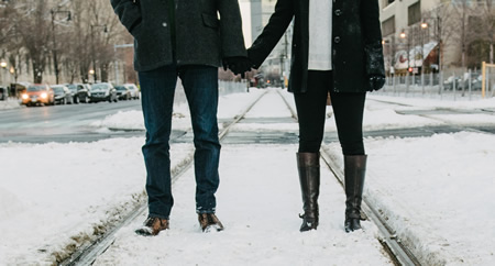image of a couple standing and holding hands
