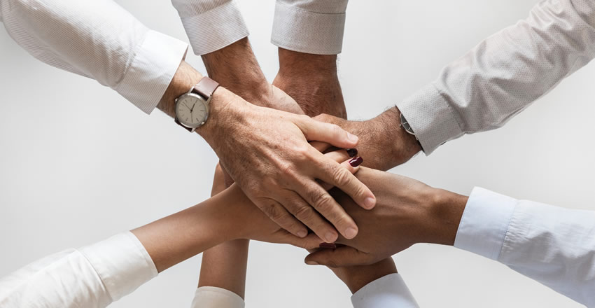 image of hands coming together