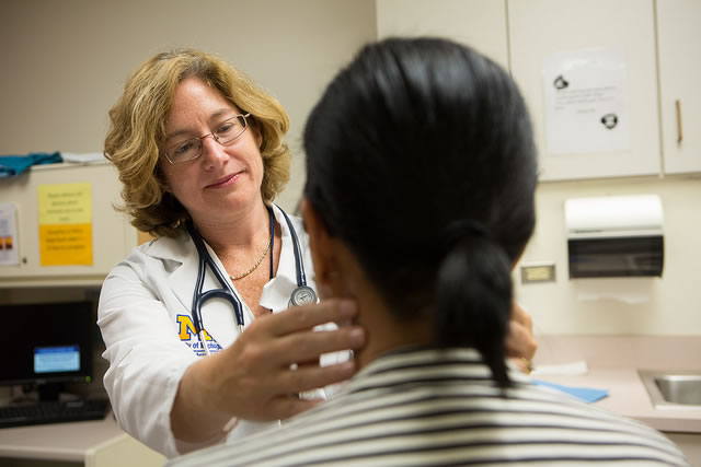 Image of Elena Stoffel, M.D. and a patient