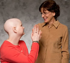 Image of young girl and woman touching hands