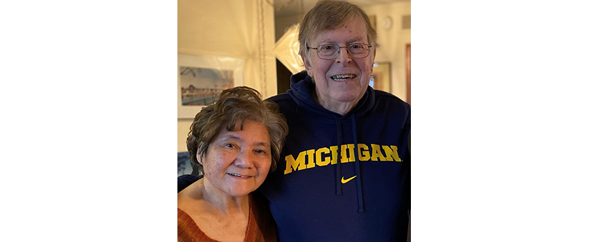 Bill Moldwin wearing a University of Michigan sweatshirt with his wife, Sally