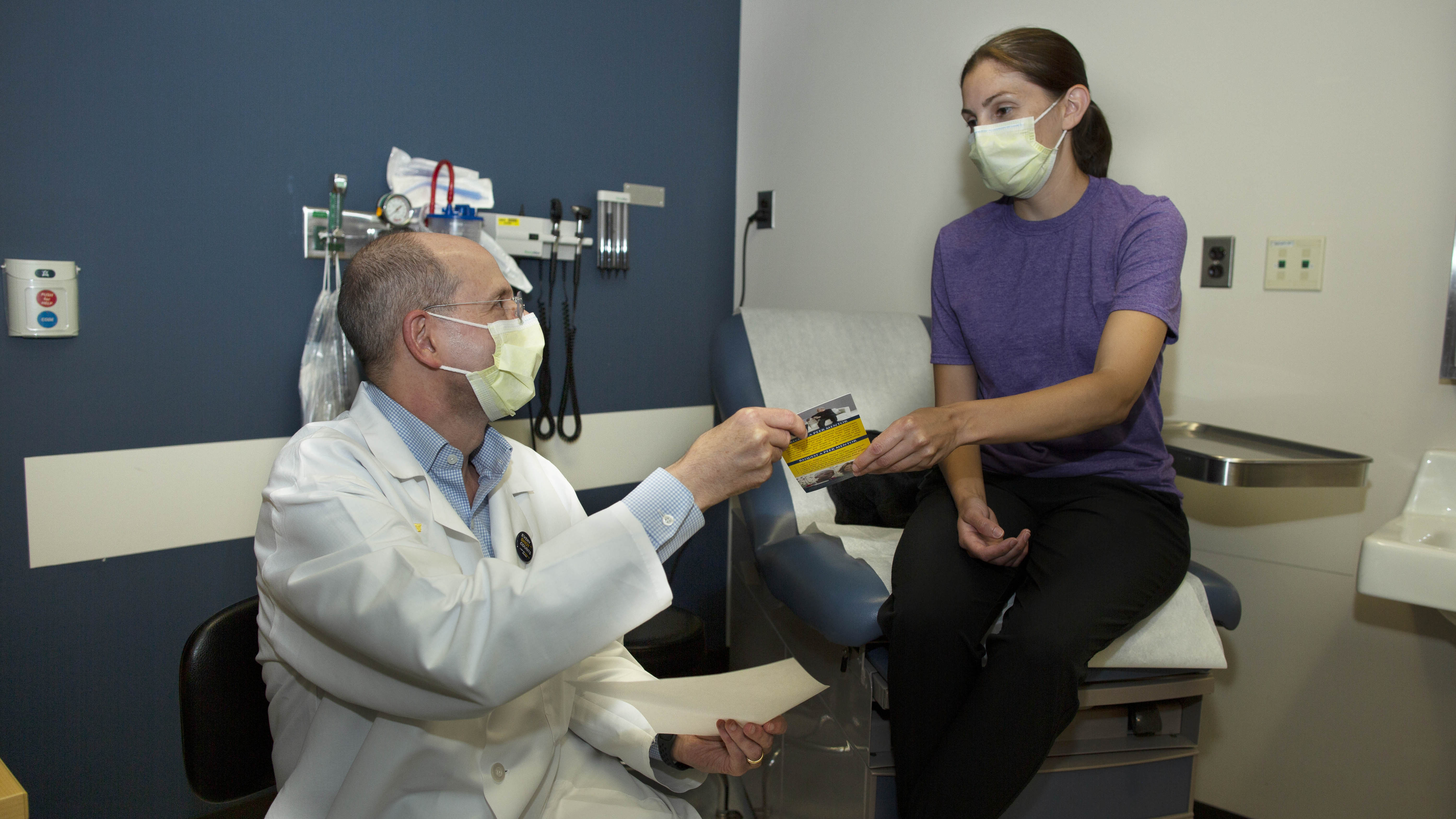 Radiation oncologist James Hayman meets with a patient to discuss cancer treatment options