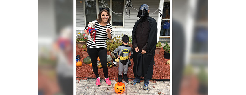 Briana Ratliff with her son dressed as Batman and her husband dressed as Darth Vader for Halloween