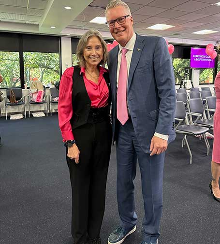 Dr. Sofia Merajver and Ed Bastian, CEO of Delta Airlines stand together