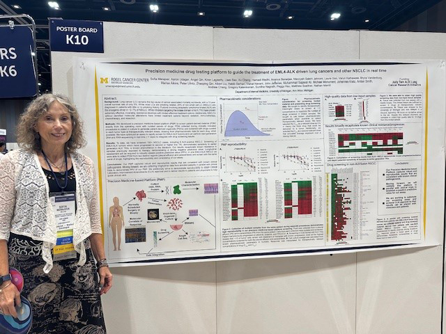 Dr. Sofia Merajver next to her poster at the ASCO conference in Japan