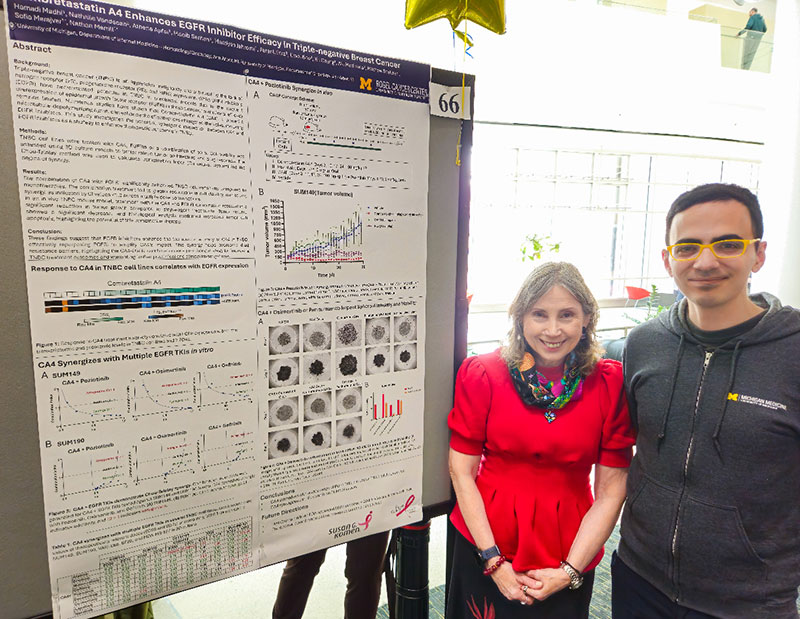 Dr. Sofia Merajver with Hamadi Madhi in front of his research poster