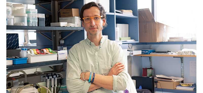 Carl Koschmann, MD in his lab