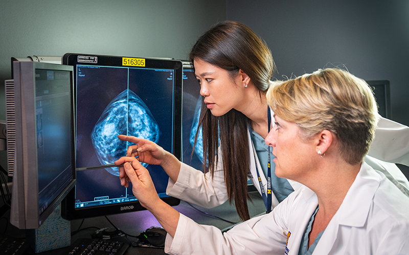 two doctors looking at a scan