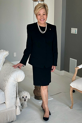 Judith Tam standing in her living room