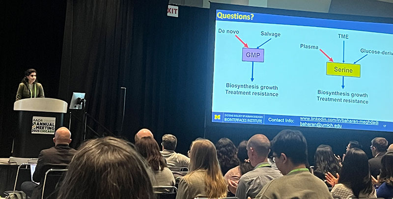Baharan Maghdadi presents her research to a group at the AACR 2025