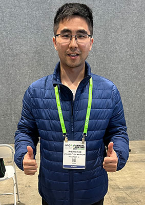 Jinsong Tao gives the thumbs up at AACR 2025