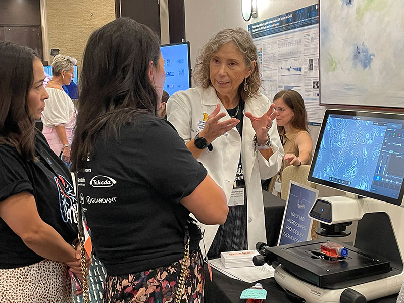 Sofia Merajver, MD, PhD meets with members of the summit participants