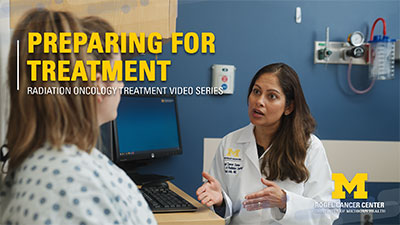 Female doctor talks to female cancer patient about radiation treatment