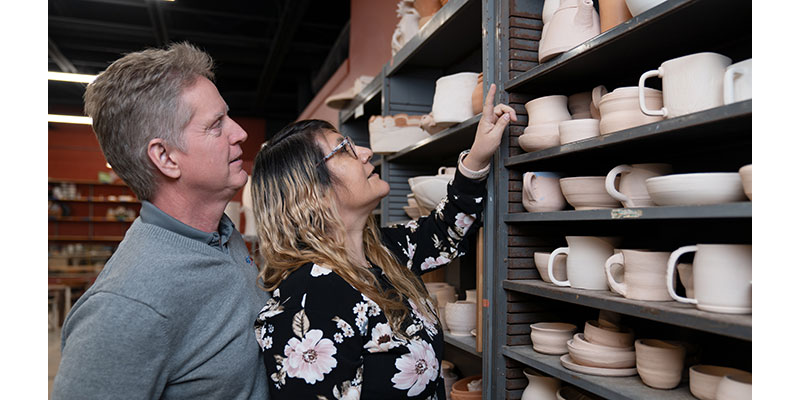 Judith and her husband Ron look at greenware
