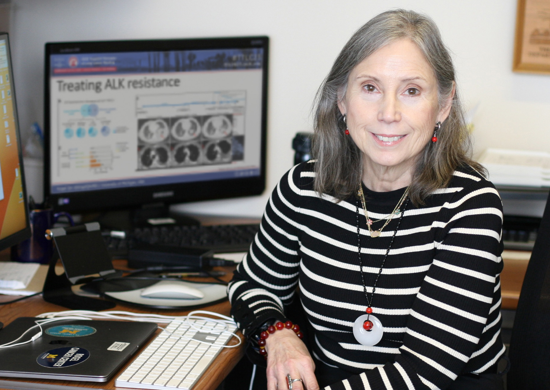 Sofia Merajver, MD, PhD sitting at her desk