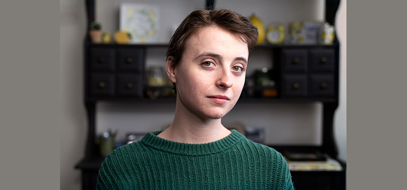Young adult woman, Sidney, in her kitchen